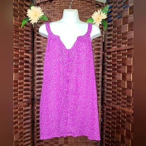 Torrid thank blouse color purple with white dots it is beautiful and it opens co